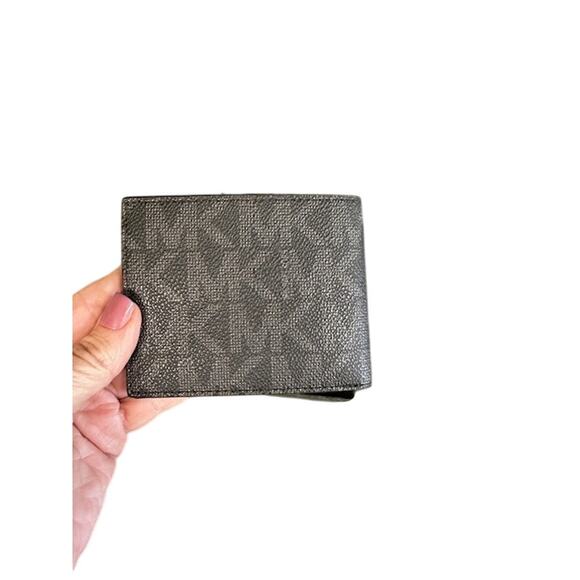 NWT Michael Kor Slim Billfold. Black with Michael Kor emblem on front & back. - Picture 4 of 6